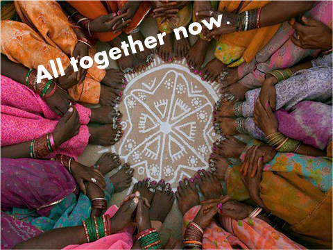 image of many people sitting with their feet together in a circle